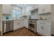 Bright, updated kitchen featuring stainless steel appliances, white cabinets, and hardwood flooring at 3095 Wills Se St, Smyrna, GA 30080