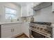 Modern kitchen featuring stainless steel appliances, white cabinets, and light marble countertops at 3095 Wills Se St, Smyrna, GA 30080