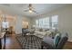 Cozy living room with large windows, hardwood floors and modern furnishings for comfortable everyday living at 3095 Wills Se St, Smyrna, GA 30080