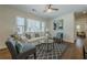 Sunlit living room boasting hardwood floors, modern furniture, and a large window view at 3095 Wills Se St, Smyrna, GA 30080