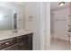 Bathroom featuring a toilet, vanity with dark cabinets, mirror and a shower at 3621 Sutters Pond Way, Kennesaw, GA 30152