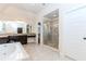 This bathroom features granite countertops, a soaking tub, and a glass shower at 3621 Sutters Pond Way, Kennesaw, GA 30152