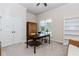Neutral bedroom with large windows, ceiling fan, closet and built in shelves at 3621 Sutters Pond Way, Kennesaw, GA 30152