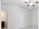 Bedroom with a ceiling fan and adjoining bathroom with dark wood vanity and tile floor at 3621 Sutters Pond Way, Kennesaw, GA 30152