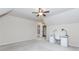 Bedroom featuring a ceiling fan, desk, and adjoining bathroom with tub/shower combination at 3621 Sutters Pond Way, Kennesaw, GA 30152