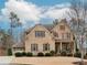 Charming two-story brick home with a well-manicured front yard and attached two car garage at 3621 Sutters Pond Way, Kennesaw, GA 30152