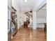 Grand foyer with hardwood floors and elegant staircase at 3621 Sutters Pond Way, Kennesaw, GA 30152