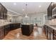 Elegant kitchen with island, granite countertops, and breakfast area at 3621 Sutters Pond Way, Kennesaw, GA 30152