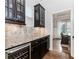 Kitchen features granite countertops, stainless steel appliances, tile backsplash, and dark cabinets at 3621 Sutters Pond Way, Kennesaw, GA 30152