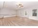 Spacious living room featuring a hardwood floor, built-in shelves, and a ceiling fan at 3621 Sutters Pond Way, Kennesaw, GA 30152