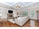 Cozy living room with fireplace, built-ins, and coffered ceilings at 3621 Sutters Pond Way, Kennesaw, GA 30152