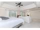 Spacious main bedroom features a tray ceiling, carpeted floors, and large windows at 3621 Sutters Pond Way, Kennesaw, GA 30152