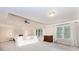 Large main bedroom features carpeted floors, tray ceiling, and large windows at 3621 Sutters Pond Way, Kennesaw, GA 30152