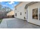 View of back patio features beige siding, multiple windows, and direct access to backyard at 414 Shadetree Ln, Lawrenceville, GA 30044