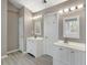 Elegant bathroom with double vanity sinks and contemporary lighting fixtures at 414 Shadetree Ln, Lawrenceville, GA 30044