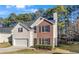 Charming two-story home featuring brick and siding, a manicured lawn, and an attached two-car garage at 414 Shadetree Ln, Lawrenceville, GA 30044