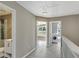 Upstairs hallway provides access to laundry and full bath with glass shower at 414 Shadetree Ln, Lawrenceville, GA 30044