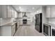 Modern kitchen featuring stainless steel appliances and granite countertops, perfect for cooking at 414 Shadetree Ln, Lawrenceville, GA 30044