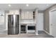 Stylish kitchen features modern stainless appliances, providing a sleek and convenient cooking space at 414 Shadetree Ln, Lawrenceville, GA 30044