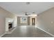 Open concept living room featuring a fireplace, fan, and an inviting front entrance at 414 Shadetree Ln, Lawrenceville, GA 30044