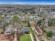 An elevated view of a home in a neighborhood with mature trees, and a distant city skyline at 875 Center Hill Nw Ave, Atlanta, GA 30318