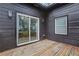 Cozy back deck featuring wood flooring and sliding glass doors offering an inviting outdoor space at 875 Center Hill Nw Ave, Atlanta, GA 30318