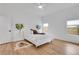 Bright bedroom with hardwood floors, a ceiling fan, and large windows providing ample natural light at 875 Center Hill Nw Ave, Atlanta, GA 30318