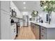 Modern kitchen featuring stainless steel appliances, white cabinets, and island at 875 Center Hill Nw Ave, Atlanta, GA 30318