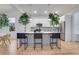 A modern open kitchen with an island and white cabinets that offers style and functionality at 875 Center Hill Nw Ave, Atlanta, GA 30318