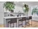 Beautiful kitchen with stylish island, pendant lighting, white countertops, and green foliage at 875 Center Hill Nw Ave, Atlanta, GA 30318