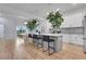 A modern kitchen and dining area filled with bright light, a kitchen island and stylish countertops at 875 Center Hill Nw Ave, Atlanta, GA 30318