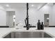 Modern kitchen sink with a black faucet, white countertop, and sleek design elements at 875 Center Hill Nw Ave, Atlanta, GA 30318