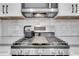 A sleek kitchen features stainless steel appliances and a modern gas range at 875 Center Hill Nw Ave, Atlanta, GA 30318