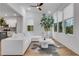 Modern living room featuring hardwood floors, white furniture, and bright natural lighting at 875 Center Hill Nw Ave, Atlanta, GA 30318