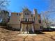 Exterior back view of the house featuring a deck and chimney at 1734 Victoria Nw Way, Kennesaw, GA 30152