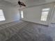 Spacious bedroom with carpet, windows letting in natural light, and a ceiling fan at 1734 Victoria Nw Way, Kennesaw, GA 30152