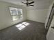 Bedroom with carpet, window, and ceiling fan at 1734 Victoria Nw Way, Kennesaw, GA 30152