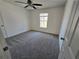 Bedroom with carpet, window, and ceiling fan at 1734 Victoria Nw Way, Kennesaw, GA 30152