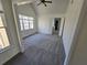 Vaulted ceiling bedroom with carpet and a window letting in natural light at 1734 Victoria Nw Way, Kennesaw, GA 30152