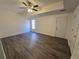 Cozy living room featuring a ceiling fan and new flooring at 1734 Victoria Nw Way, Kennesaw, GA 30152