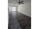 Bright living room featuring modern ceiling fan and new floors at 1734 Victoria Nw Way, Kennesaw, GA 30152