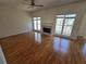 Open-concept living room with hardwood floors, a fireplace, and abundant natural light at 1734 Victoria Nw Way, Kennesaw, GA 30152