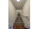 Carpeted stairway with white walls and a handrail at 1734 Victoria Nw Way, Kennesaw, GA 30152
