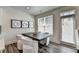 Cozy dining area with modern table and chairs next to a bright window at 2704 Ne Almand Ln, Conyers, GA 30013