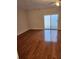 Living room with hardwood floors, fireplace, and sliding glass door at 3874 Austin Park Ln, Decatur, GA 30032