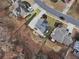 An aerial view of the property showcases its backyard, including landscaping and the home's outdoor spaces at 4126 Dream Catcher Dr, Woodstock, GA 30189