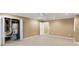 Spacious basement with tile flooring and door to the utility closet at 4126 Dream Catcher Dr, Woodstock, GA 30189