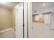 View through doorway into finished basement with tile flooring, recessed lighting, and exterior door at 4126 Dream Catcher Dr, Woodstock, GA 30189