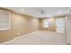 Finished basement featuring tile flooring, recessed lighting, built-in shelves, and door to the exterior at 4126 Dream Catcher Dr, Woodstock, GA 30189