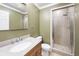 Bathroom featuring a vanity, toilet, mirror, and tiled shower at 4126 Dream Catcher Dr, Woodstock, GA 30189